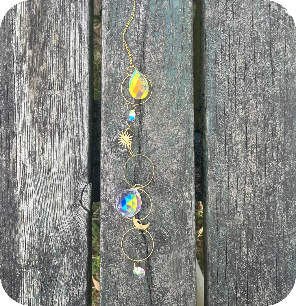 A suncatcher on a wooden table.