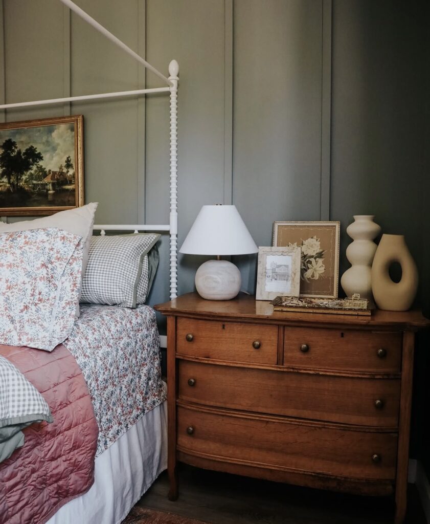 An antique nightstand with geometric vases.