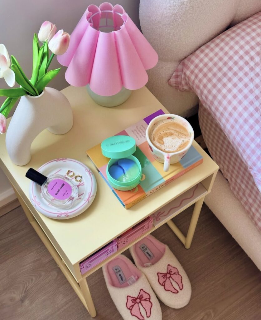 A yellow nightstand with colorful accessories.