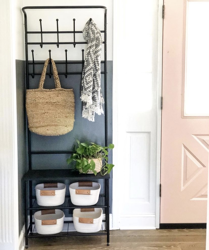 An entryway with a coat and shoe rack.