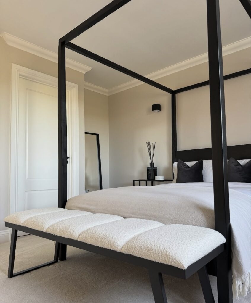 A black and white canopy bed.