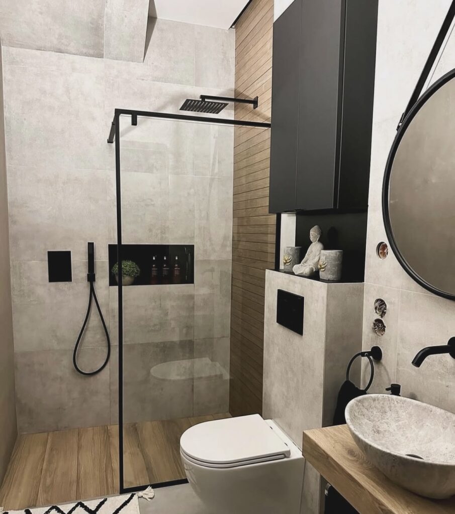 A modern bathroom with a black cabinet.