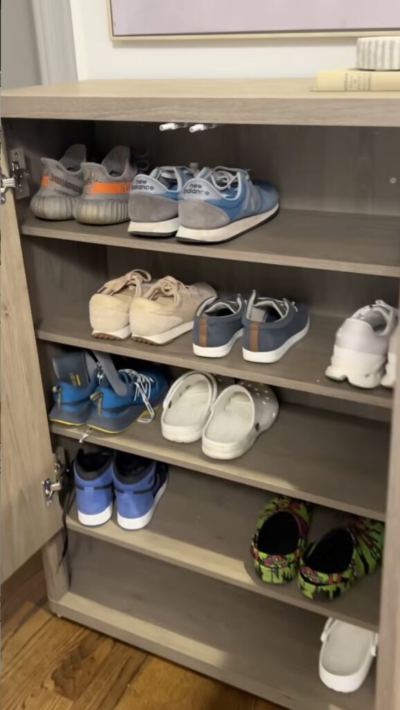 An entryway with a shoe cabinet.
