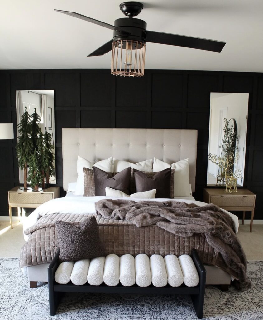 A bedroom with a black wall.
