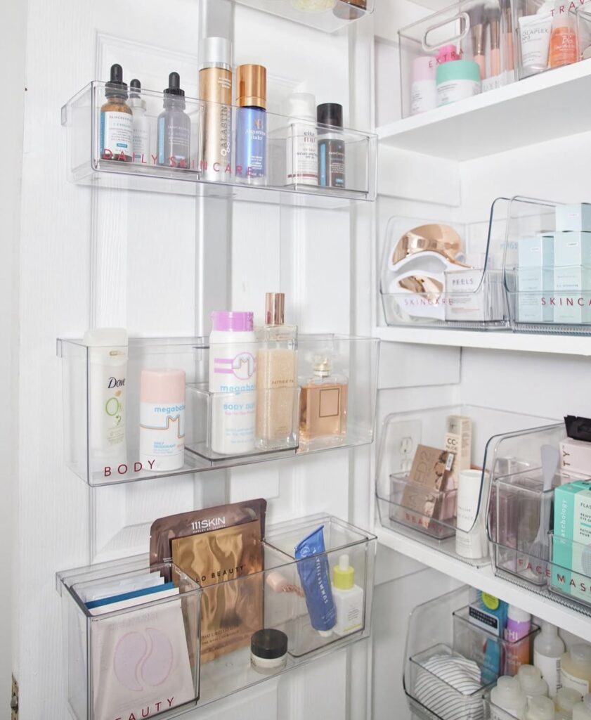 A clear over the door organizer filled with bathroom products.