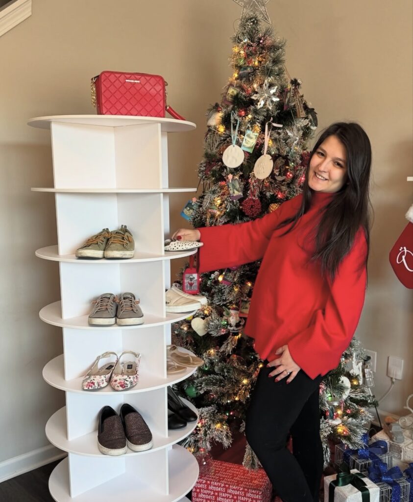 A rotating shoe storage tower in a bedroom.