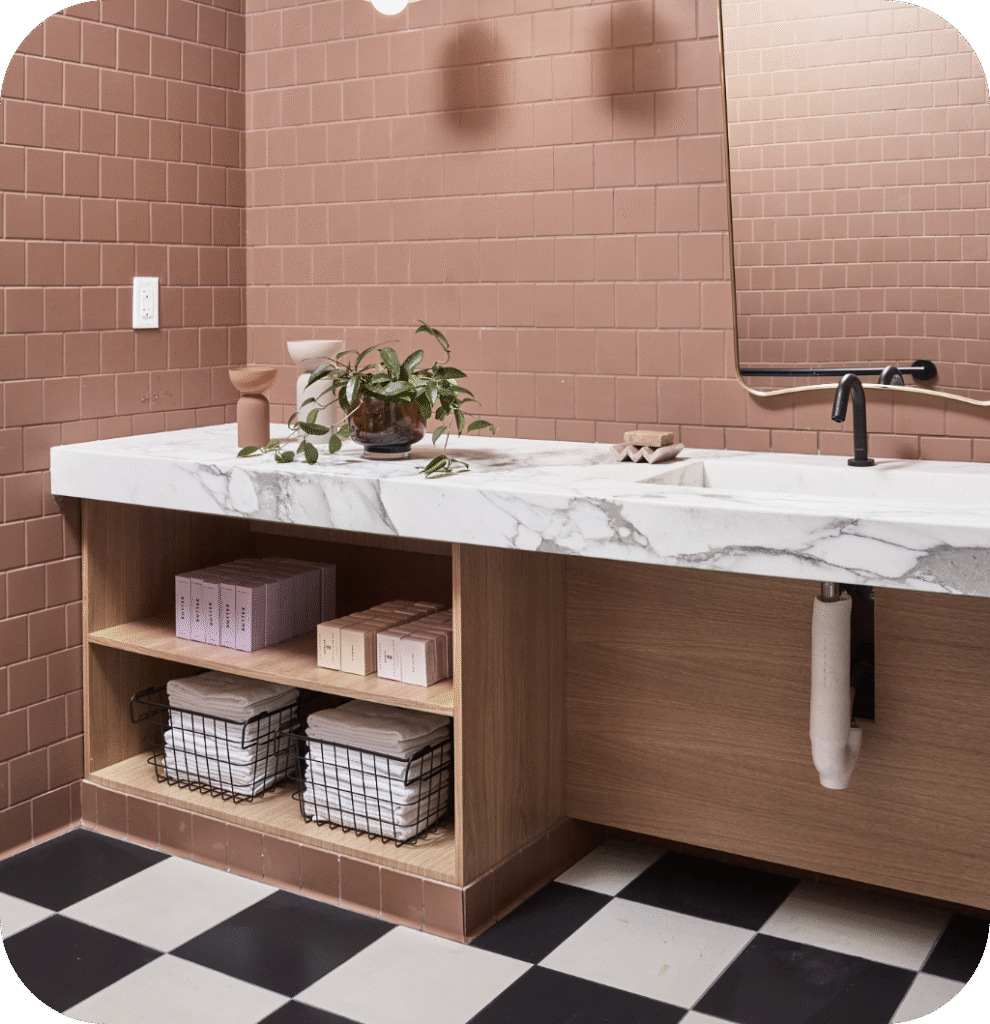 A pink bathroom with organizers.