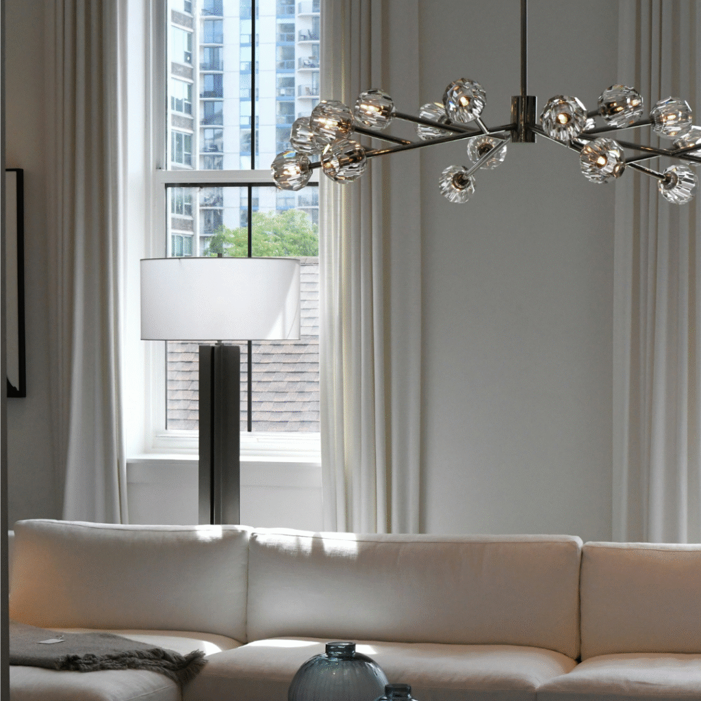 A living room with an intricate light fixture.