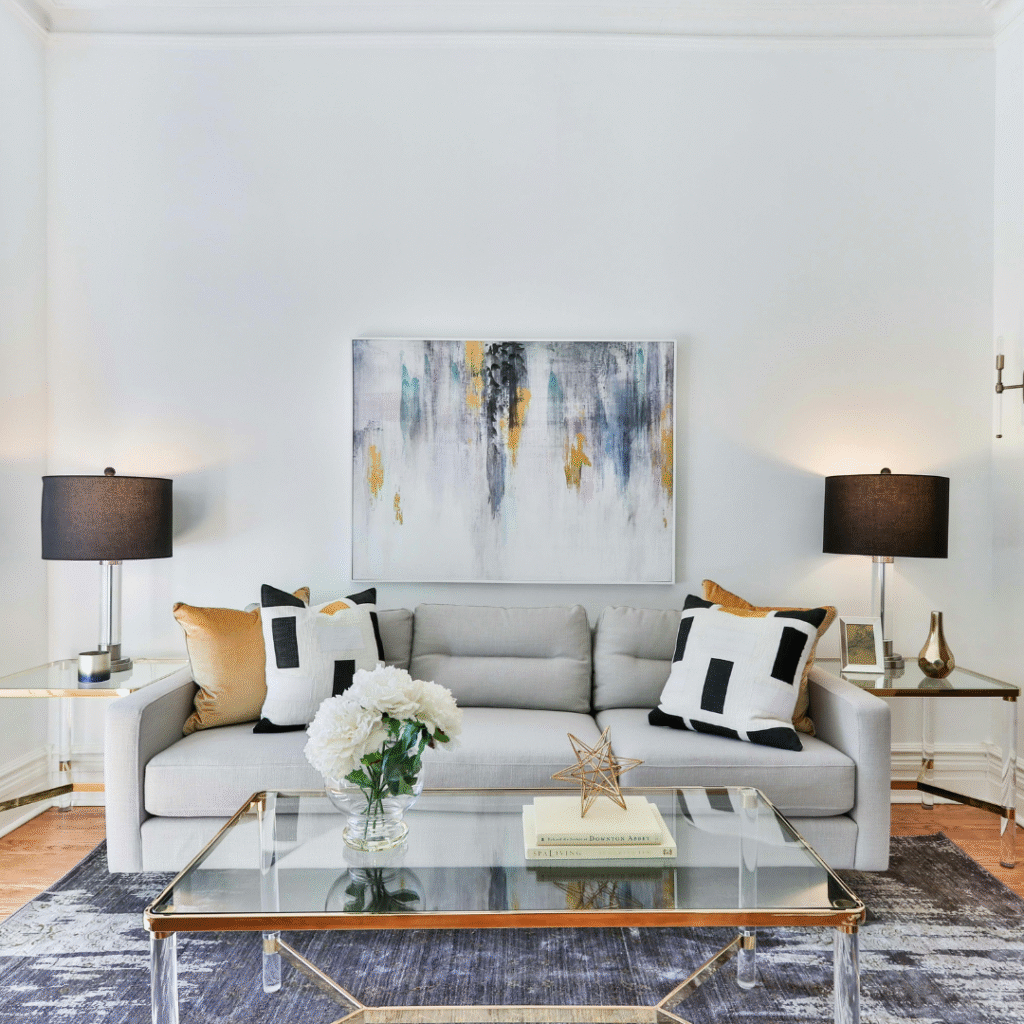 A living room with an abstract canvas.