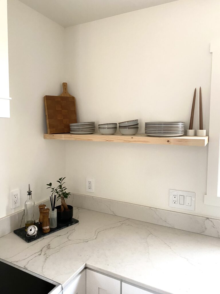 A kitchen with open shelves.