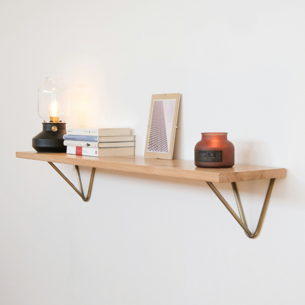 A wooden wall-mounted shelf.