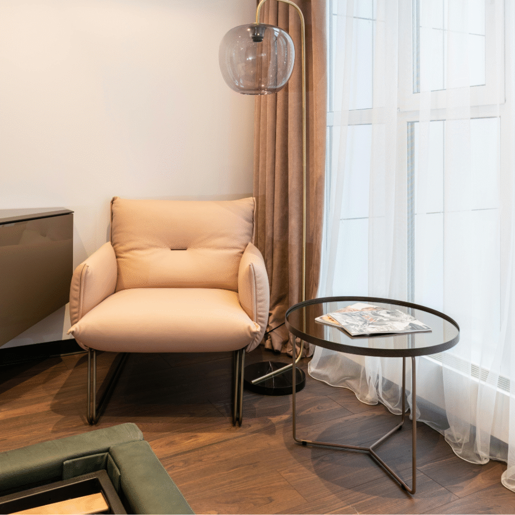 A living room with floor-to-ceiling curtains.