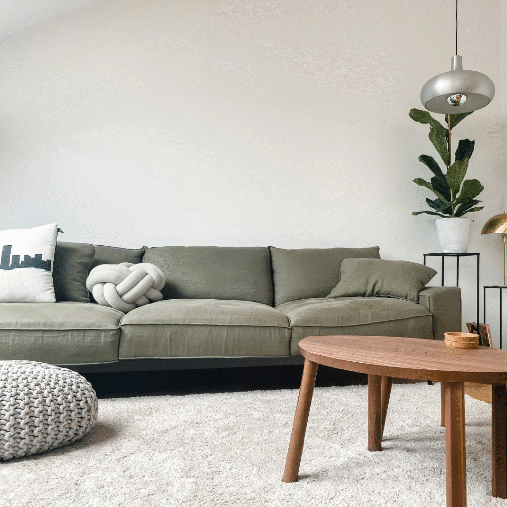 A modern living room with a white rug.