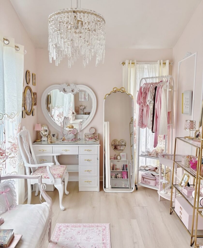 A coquette bedroom with white antique furniture and pink accessories.