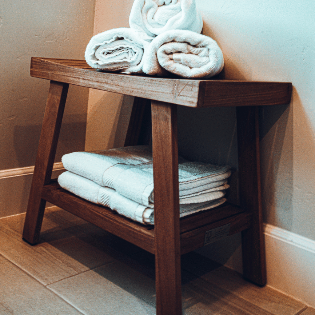 Towels on a wooden stool.