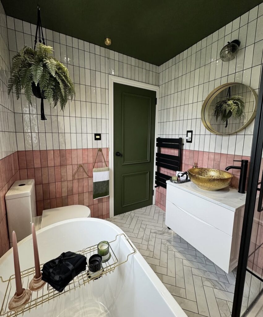 A modern bathroom that is green and pink.