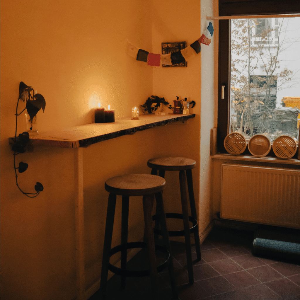A cozy kitchen with candles.