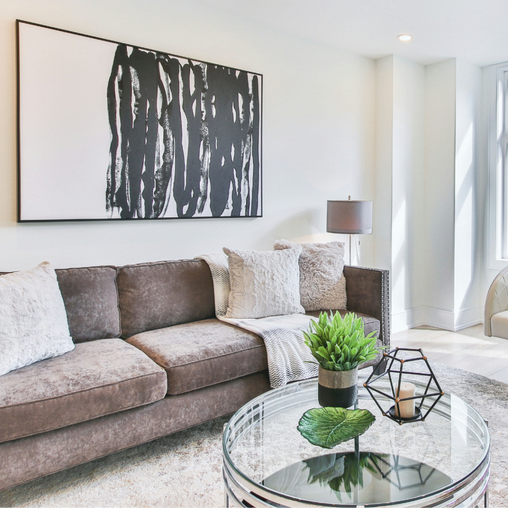 A modern living room with a glass coffee table.