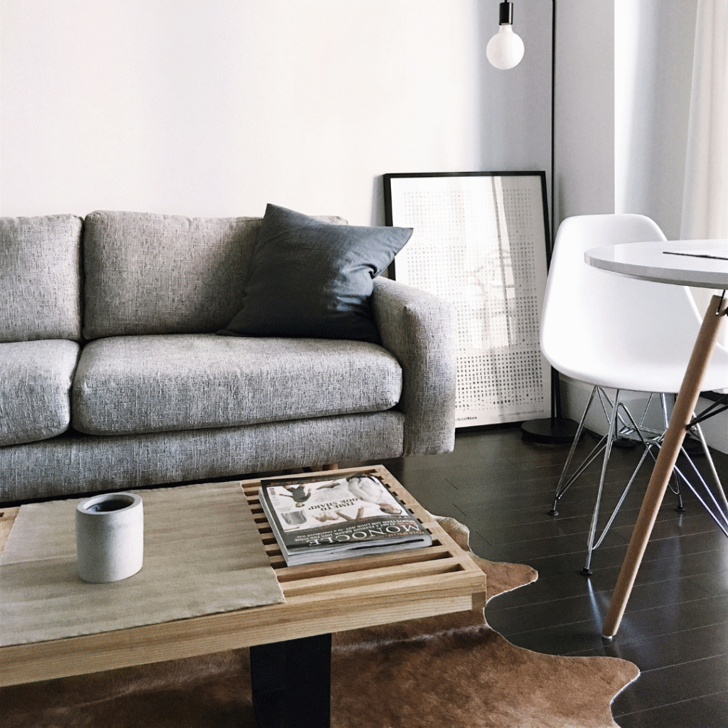 A modern living room with a black mirror.