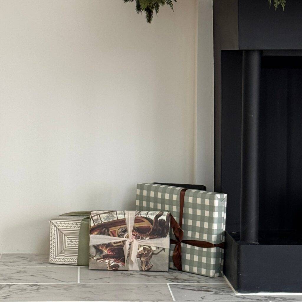Wrapped gifts near a mantel.