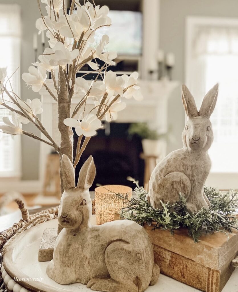 Wooden bunny figurines with decorative books.