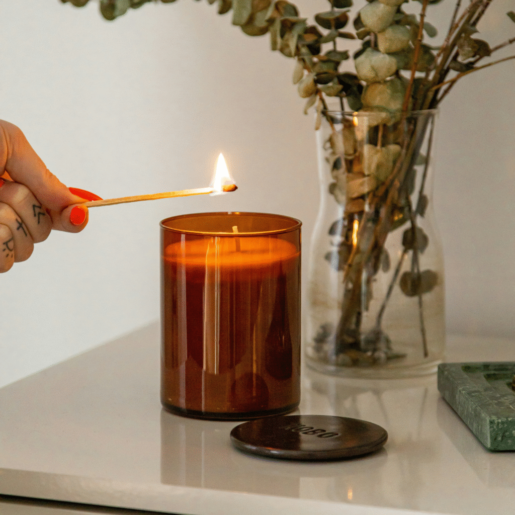 A woman lighting a candle.