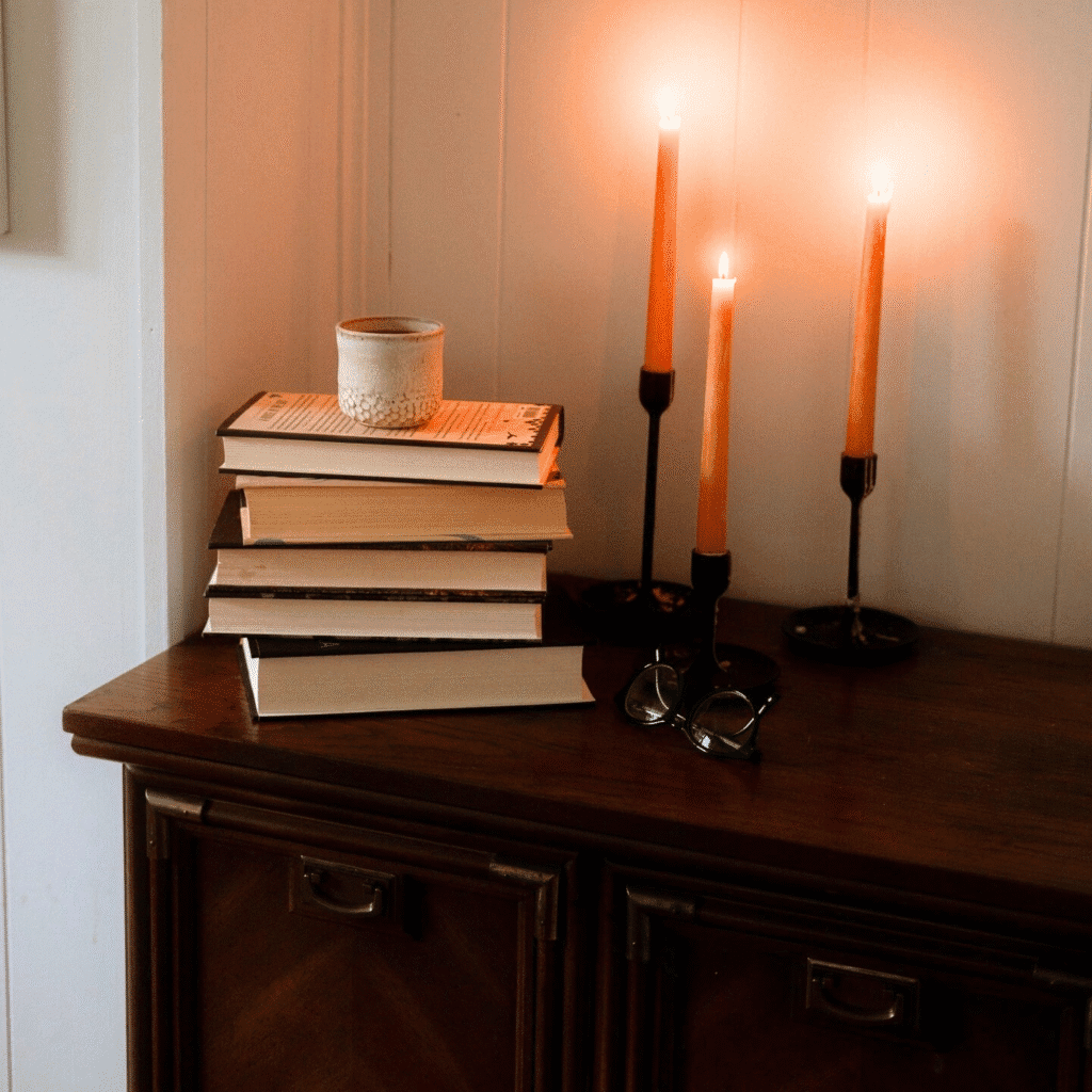 Candles and antique books.