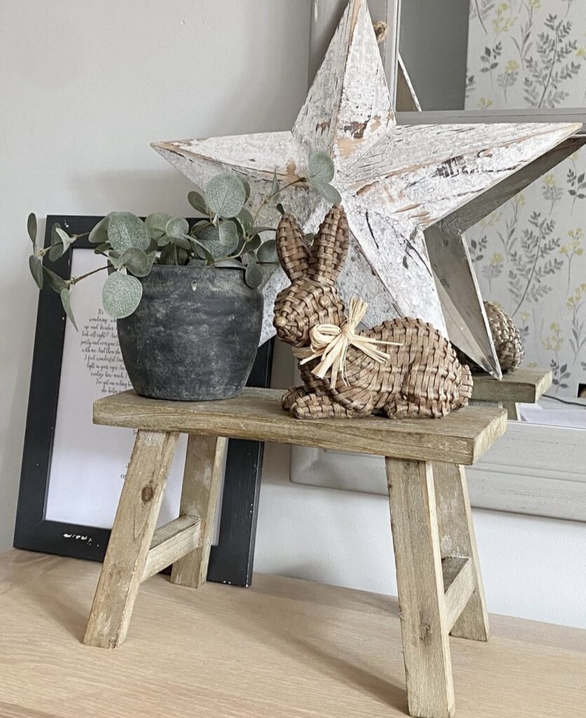 A woven bunny figurine and a white distressed star.