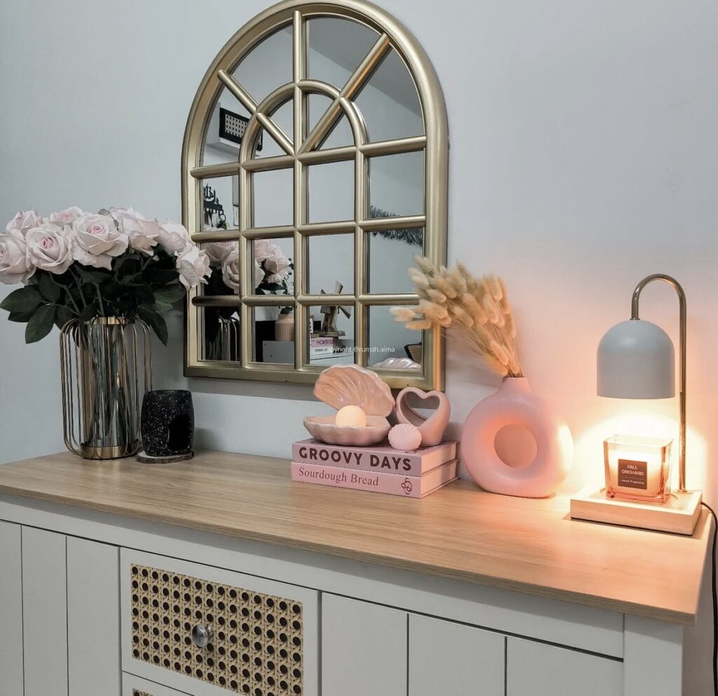 A modern entryway with pink accessories.