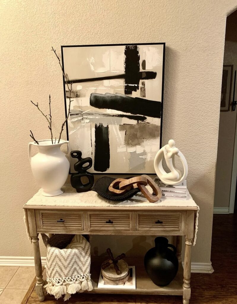 A modern entryway with geometric figurines.