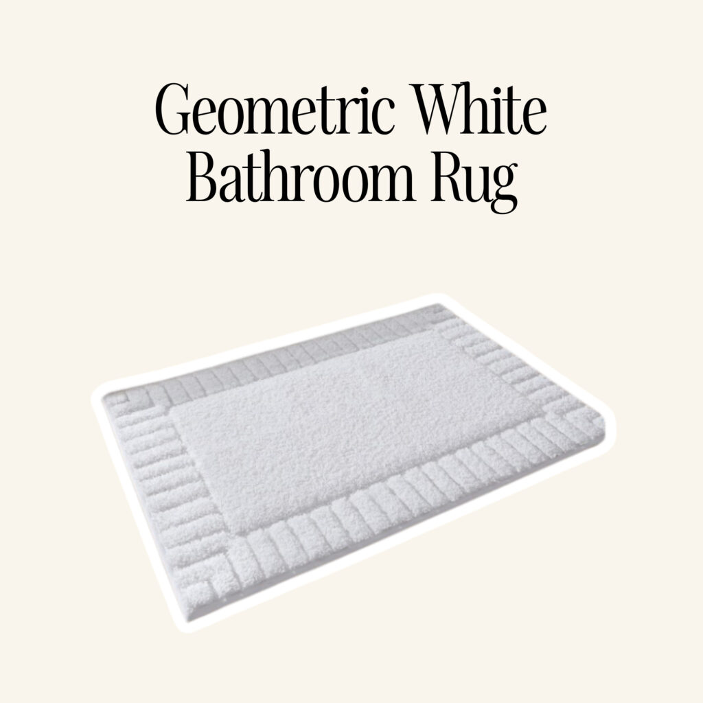 A geometric white bathroom rug.