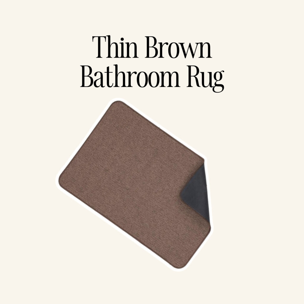 A thin brown bathroom rug.