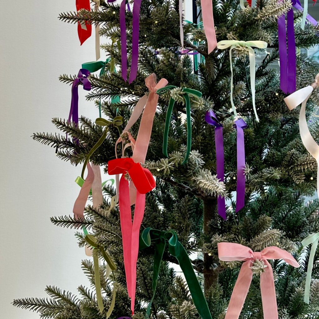 A Christmas tree filled with ribbon bows.