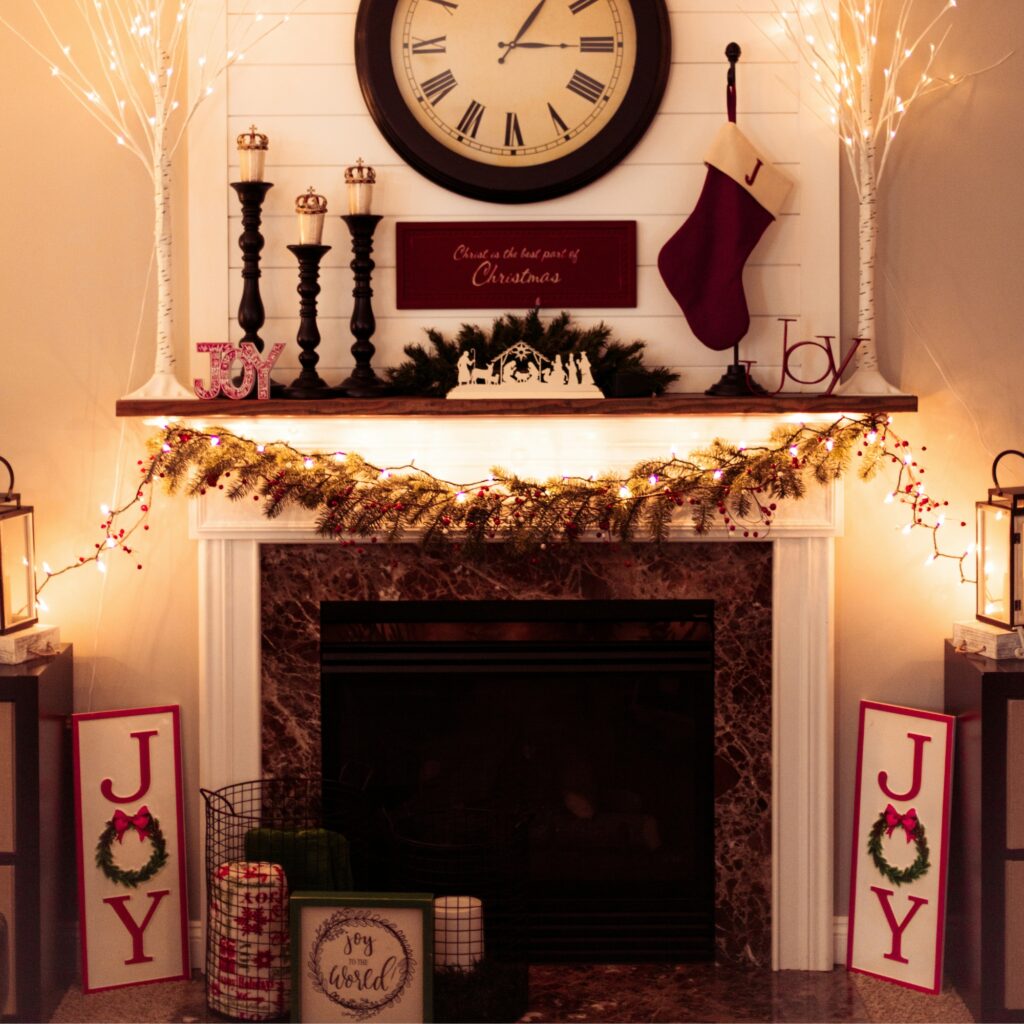 A Christmas mantel with string lights.