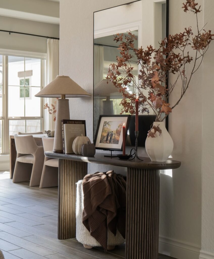 A modern entryway with fall accessories.