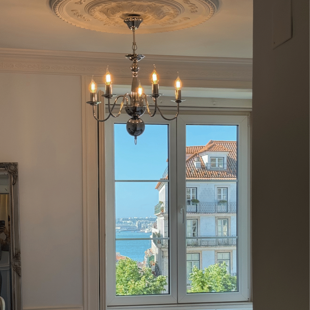 A chandelier in a traditional bedroom.