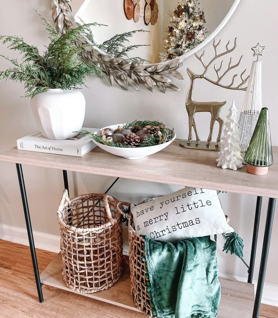 A wooden console table with Christmas accessories.