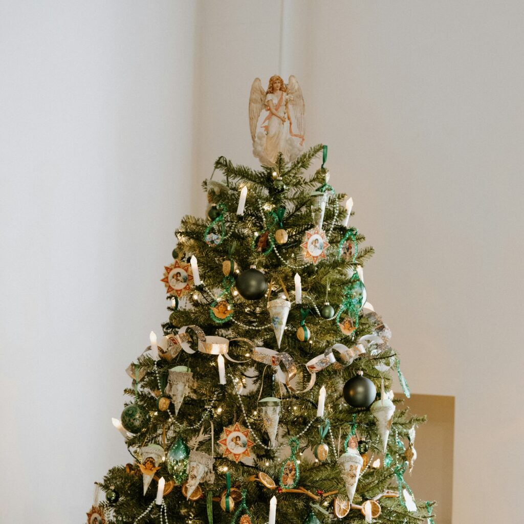 A Christmas tree with an angel topper.