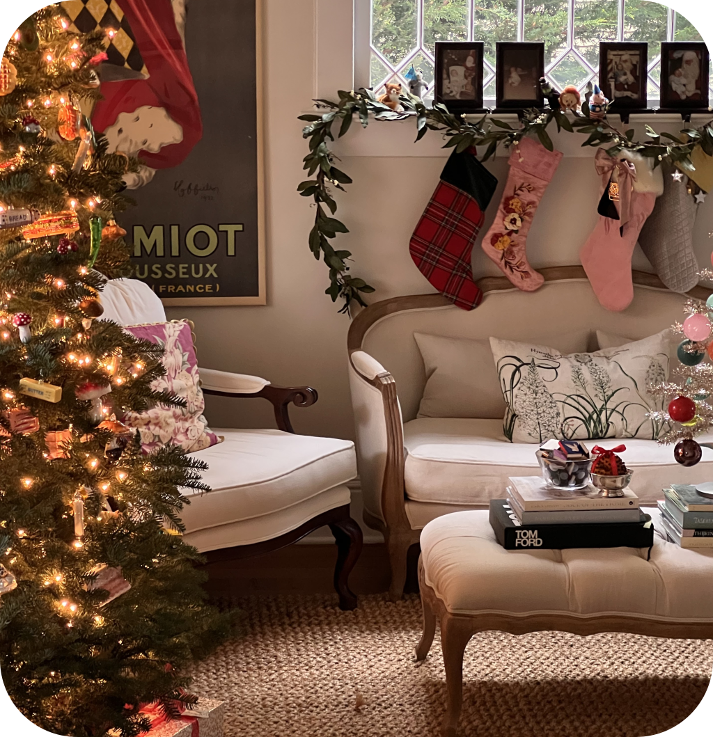 A Christmas living room with antique furniture.