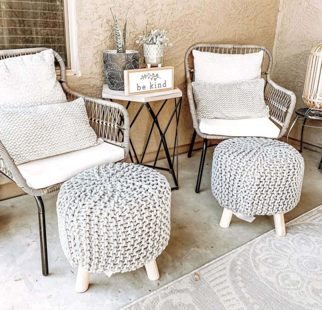 Crochet poufs on a porch.