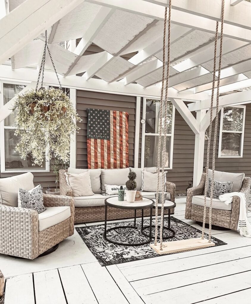 A patio with a swing.
