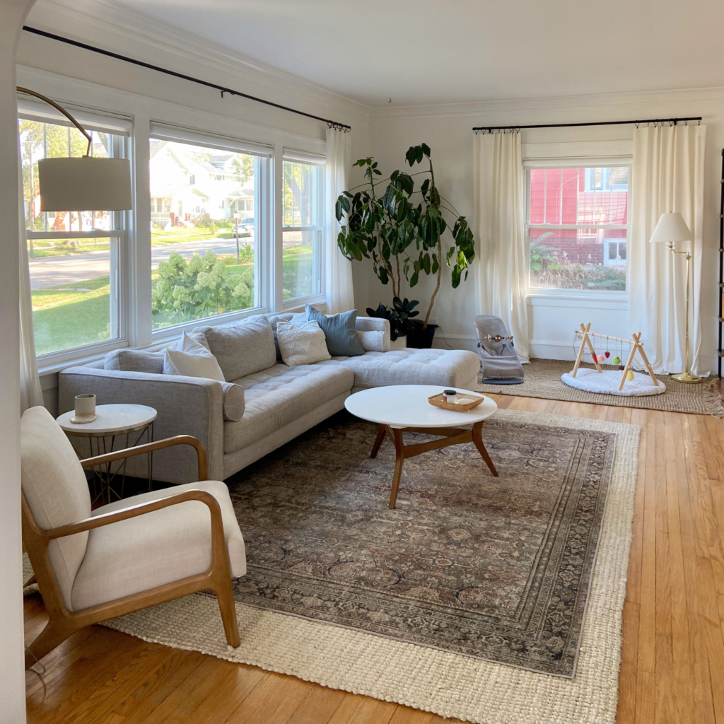 A living room with curtains.