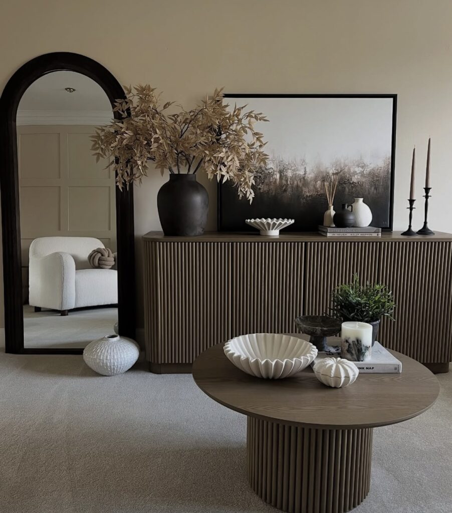 A living room with a mirror.