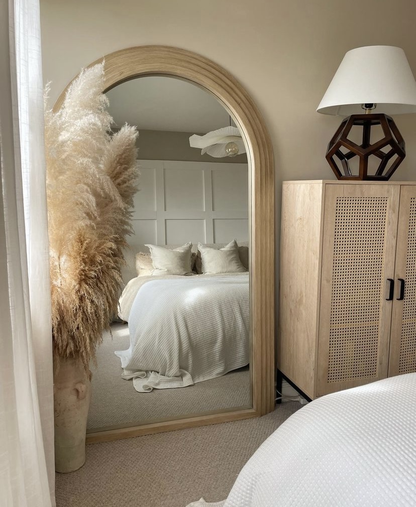 A mirror in a bedroom.