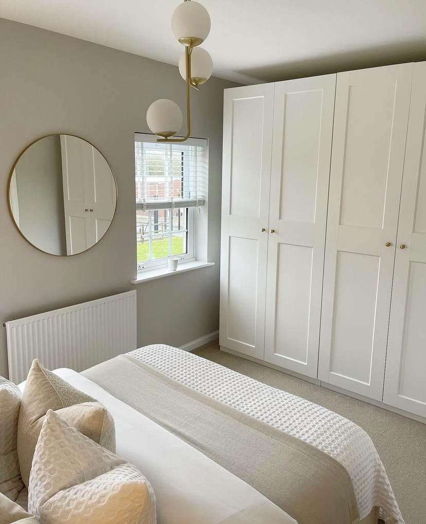 A mirror in a bedroom.