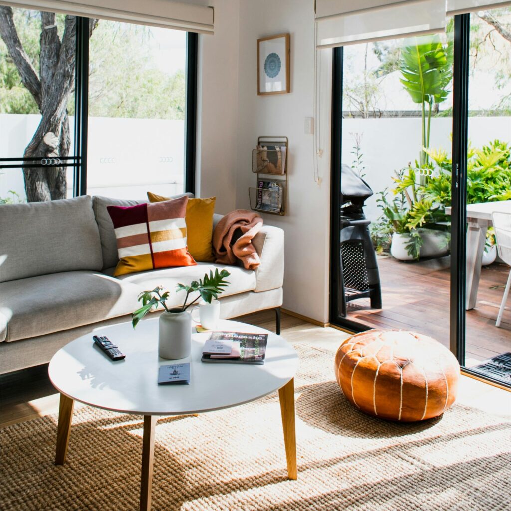 A living room with a rug.