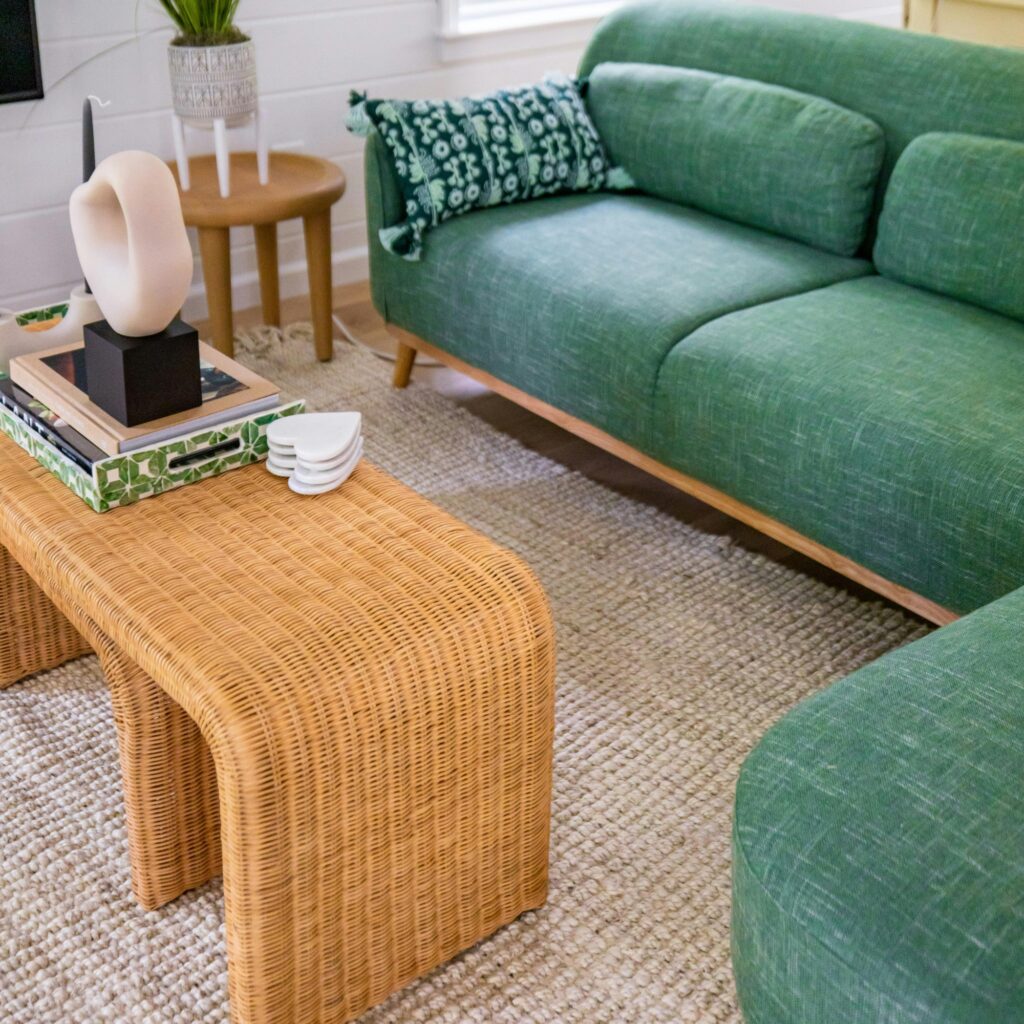 A living room with a rug.