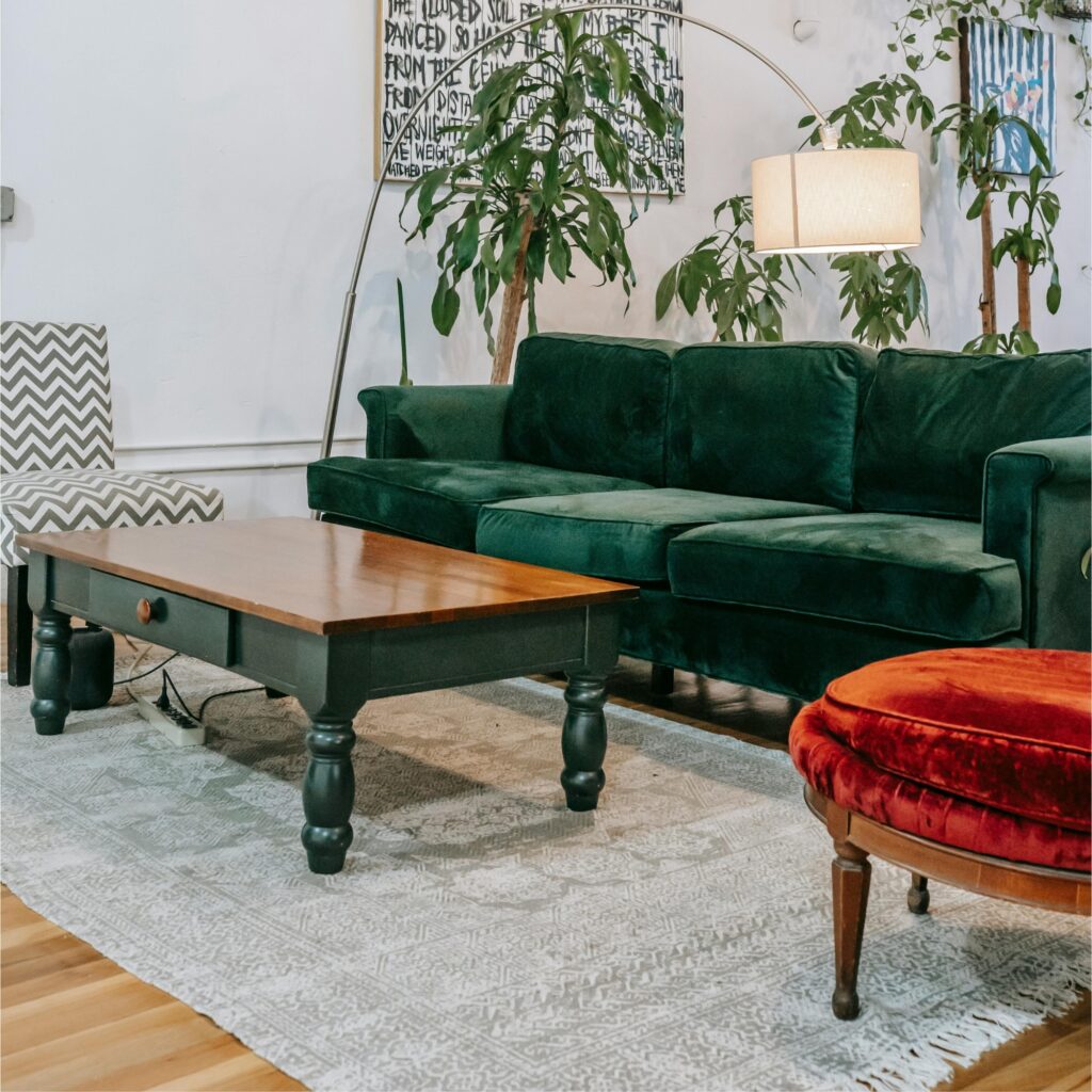 A living room with a rug.